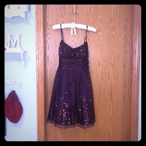 Plum colored sequined homecoming dress.